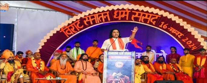 A large gathering of saints and devotees at the Sanatan Dharma Sansad in Kartar Nagar, Delhi.